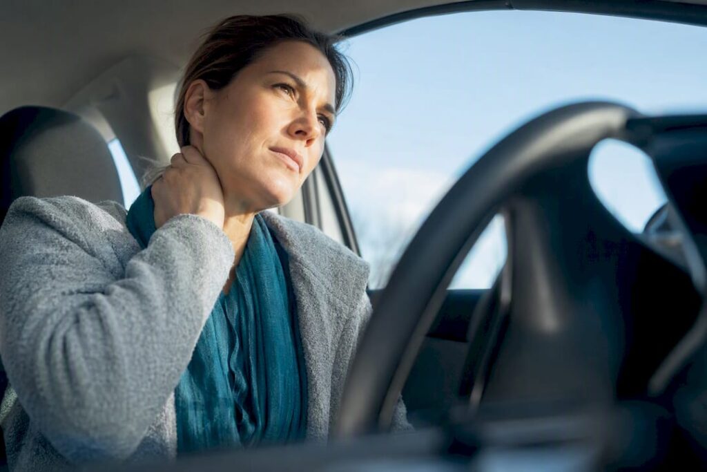 Adult supporting sore neck after whiplash